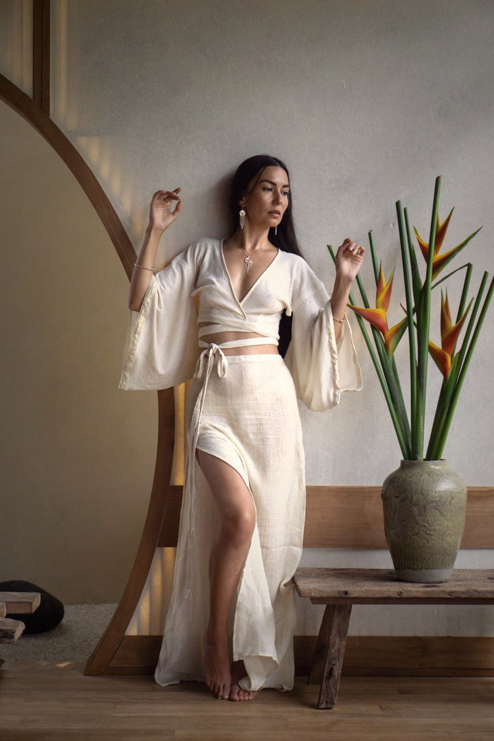 Mana Shirt with Japanese Kimono-Inspired Sleeves, Organic Cotton, Bamboo, and Linen, Adjustable for Versatile Styling, Featuring Shimmering Edges and Beaded Tie Ends.