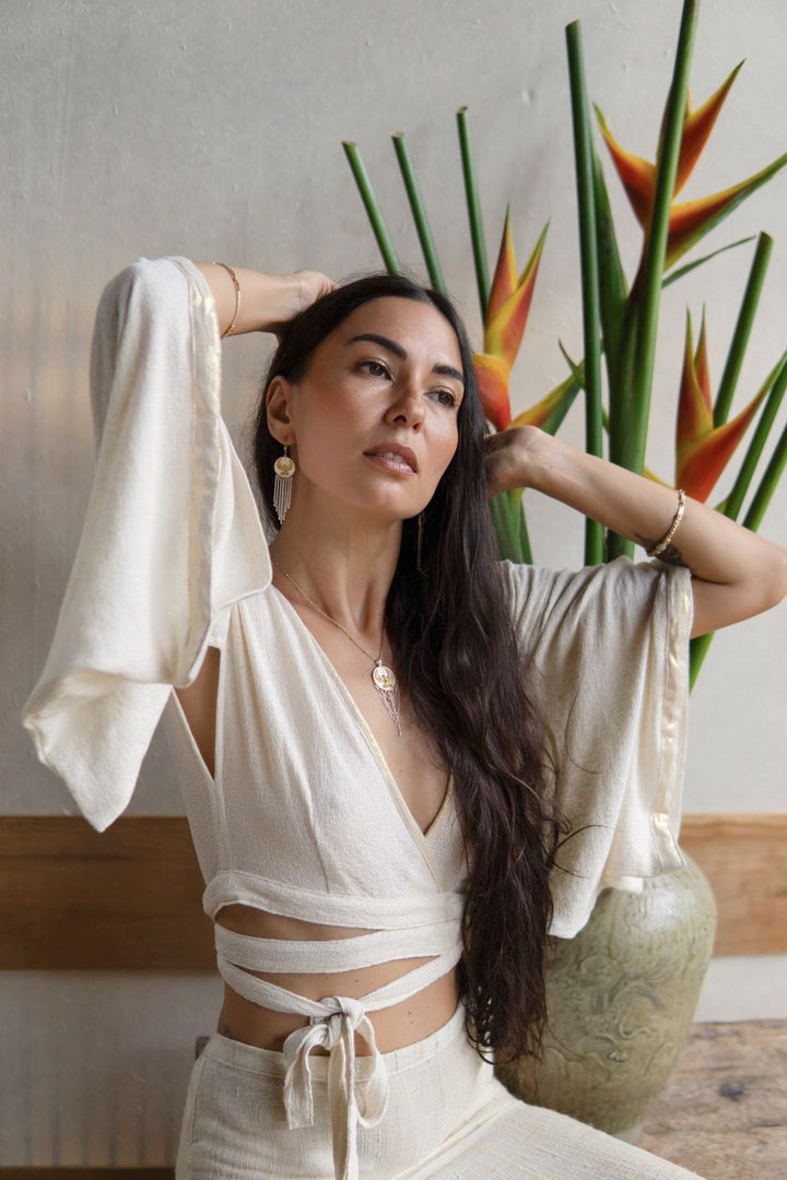 Mana Shirt with Japanese Kimono-Inspired Sleeves, Organic Cotton, Bamboo, and Linen, Adjustable for Versatile Styling, Featuring Shimmering Edges and Beaded Tie Ends.