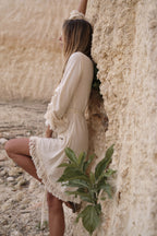 Ayumi Dress in Natural White - Organic Cotton and Linen Blend with Hand-Beaded Belt, Adjustable Sleeves, and Fringe Edges. Perfect for Elegant, Sustainable Fashion