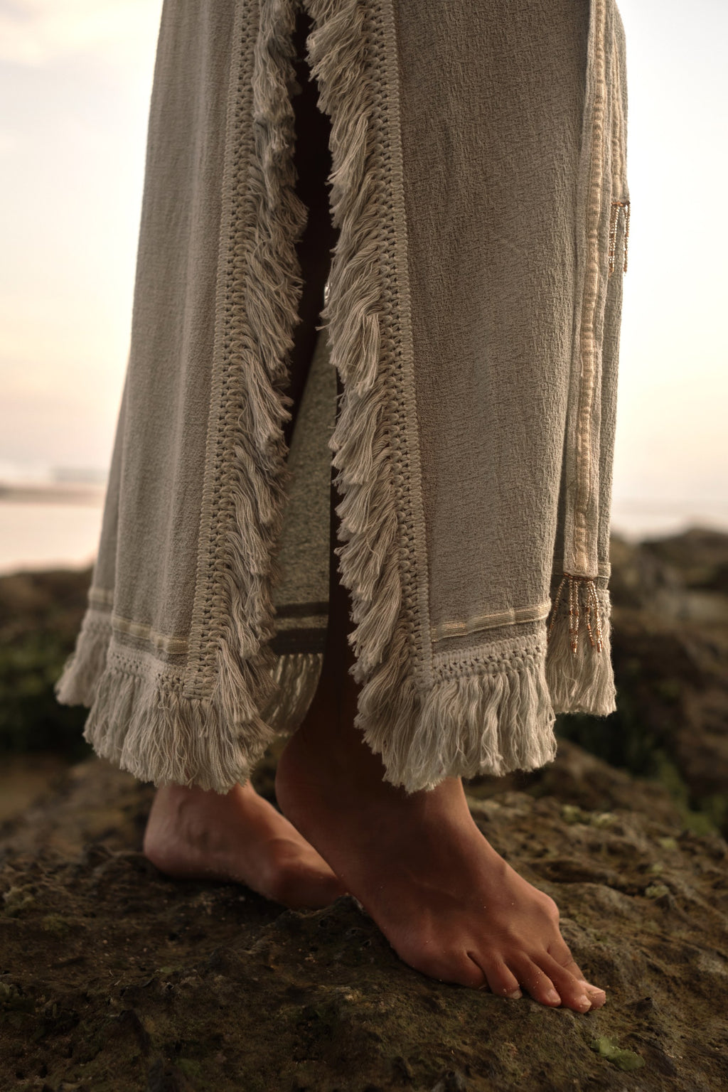 Navaia Dress in Organic Cotton and Linen Blend with Shimmering Trims, Braided Accents, and Hand-Beaded Glass Beads and Freshwater Pearls for Elegant Styling.