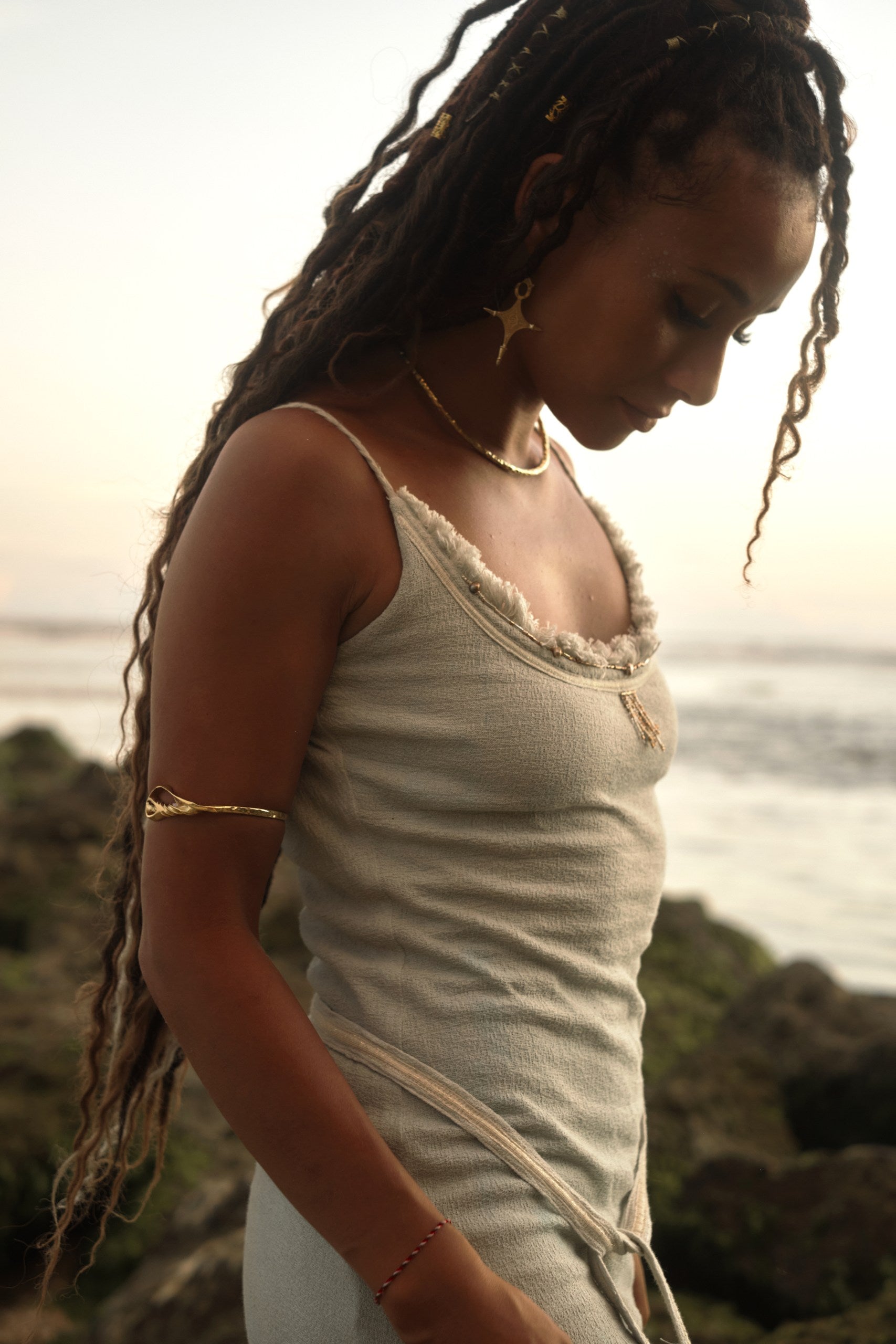 Navaia Dress in Organic Cotton and Linen Blend with Shimmering Trims, Braided Accents, and Hand-Beaded Glass Beads and Freshwater Pearls for Elegant Styling.