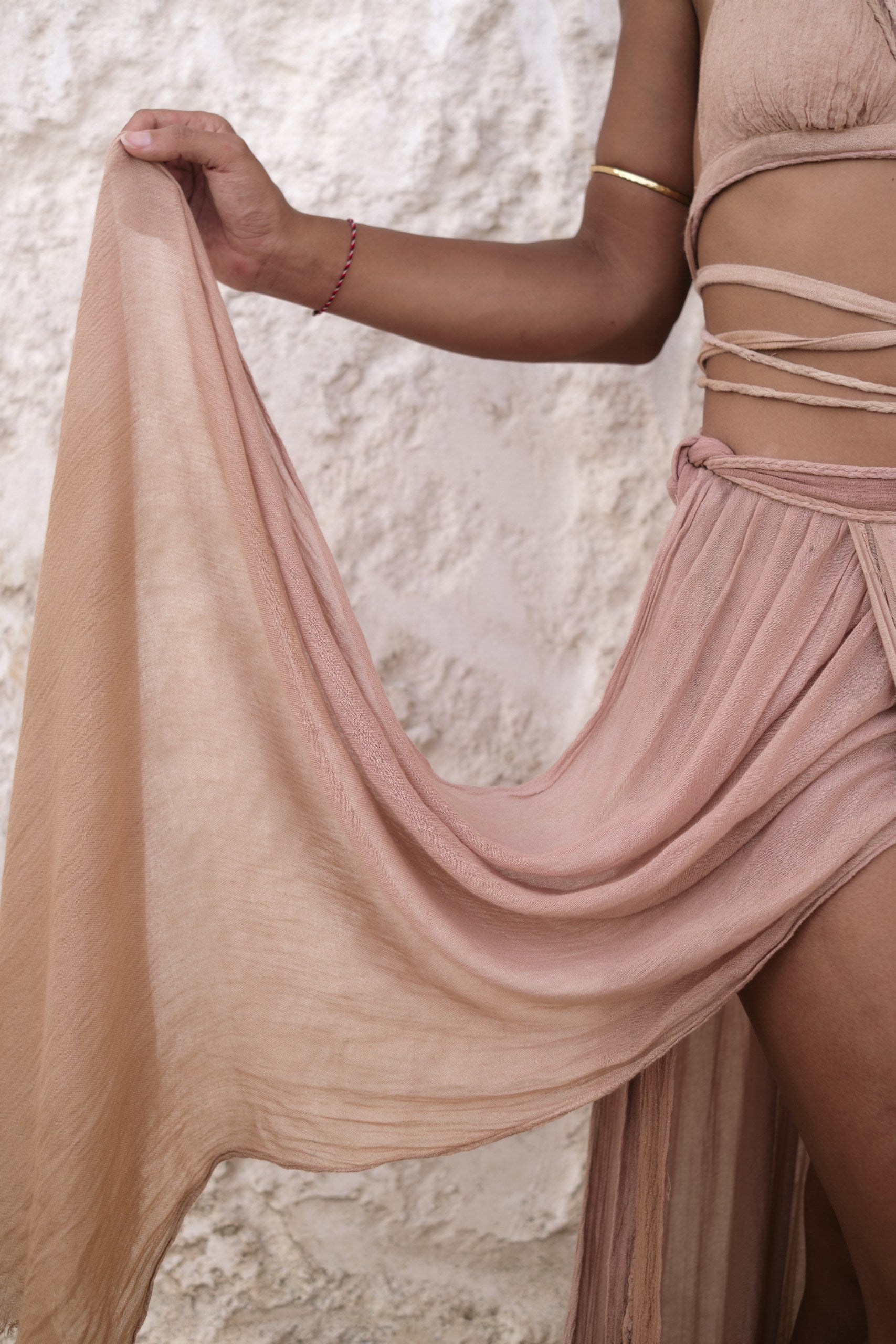 Detailed close-up of the Inika Top, showcasing intricate hand-braided straps and natural fabric textures, embodying Bird of Paradise’s bohemian and ethical fashion principles.