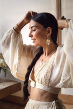 Versatile Organic Cotton, Bamboo, and Linen Blend Garment with Braided Detail and Airy Sleeves, Perfect for Relaxed Elegance.