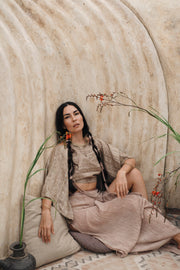 Adjustable waist buttons on Padma raw silk boho top
