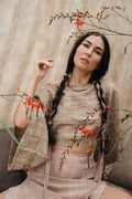 Model wearing Padma raw silk Bali boho shirt in natural cream
