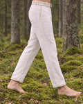 Side view of the Kairos linen trousers worn with the matching embroidered belt