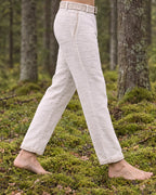 Side view of the Kairos linen trousers worn with the matching embroidered belt