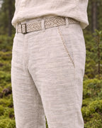Detail of the embroidered belt and hand-stitched pocket trim on the Kairos Pants
