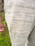 Close-up of the hand-loomed linen fabric of the Kairos Pants