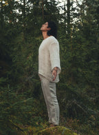 Full length view of the Serat shirt worn with natural linen trousers