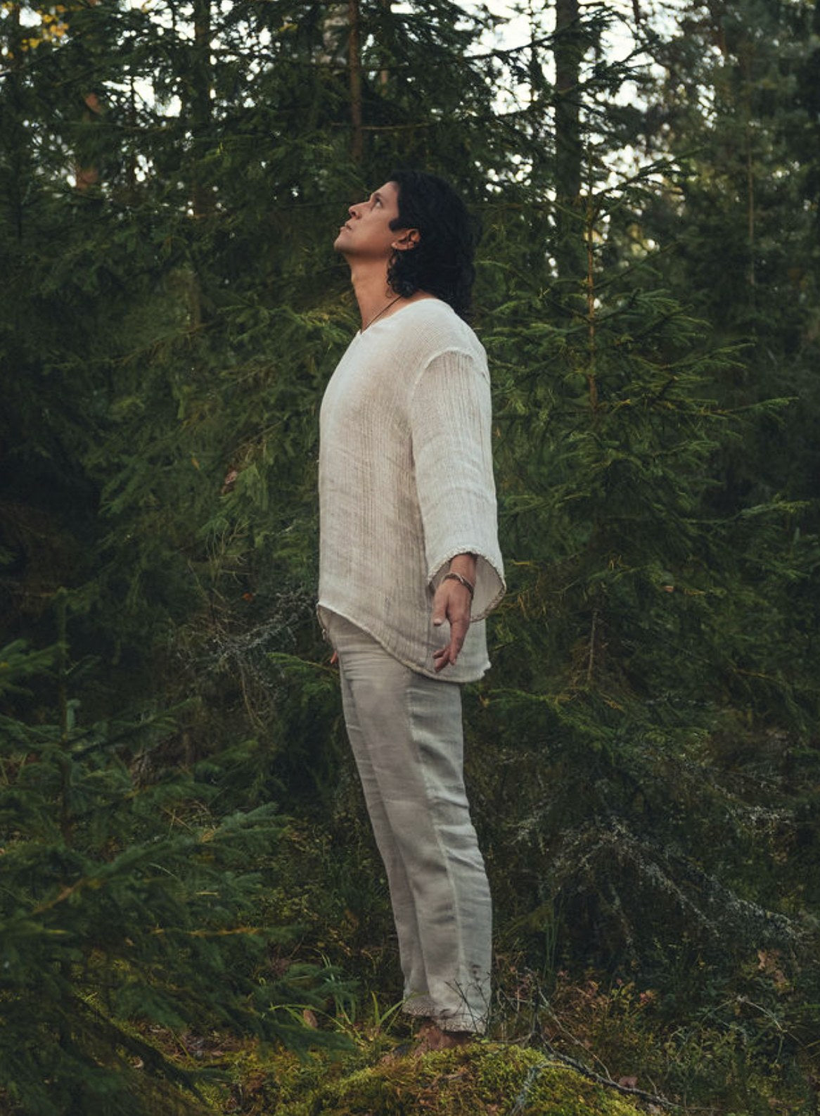 Full length view of the Serat shirt worn with natural linen trousers