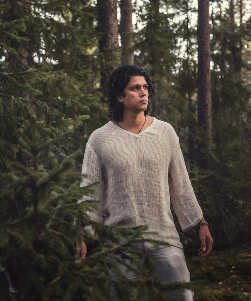 Serat shirt worn walking through pine forest
