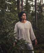 Serat shirt worn walking through pine forest