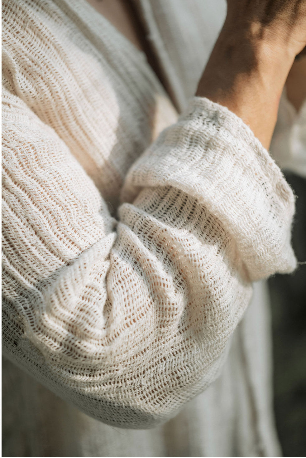 Sleeve detail of the Tenun shirt showing the loose linen weave