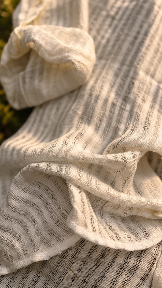 Close-up of the Udara handloom fabric with its fine woven pinstripe